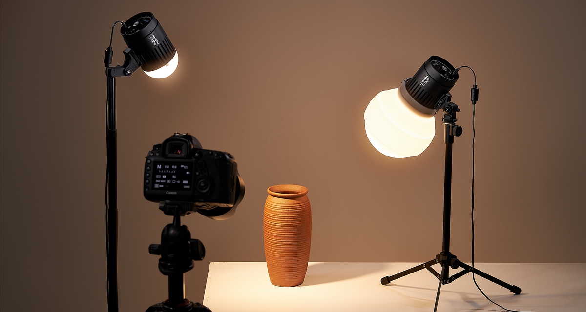 Two Godox Litemons LC30-series LED lights lighting a vase on a tabletop