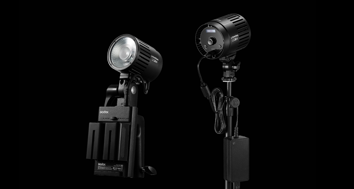 Two Godox Litemons LC30-series LED lights, one on a battery grip and one on a stand with a battery pack