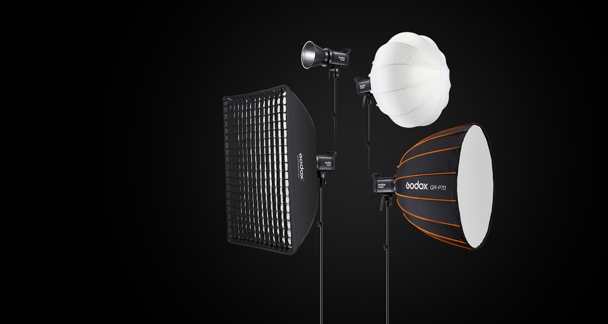 Godox SL60II-series lights on stands with a grid softbox, a lantern softbox and a parabolic softbox