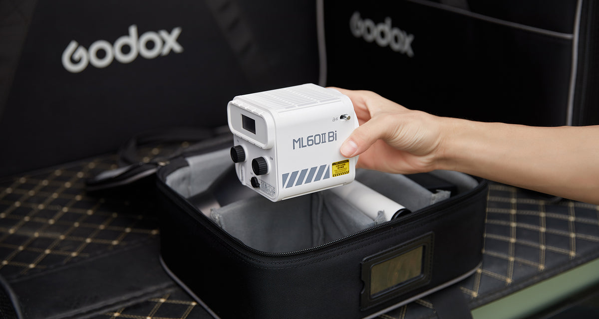 Godox ML60II Bi LED video light held above its Godox carry bag