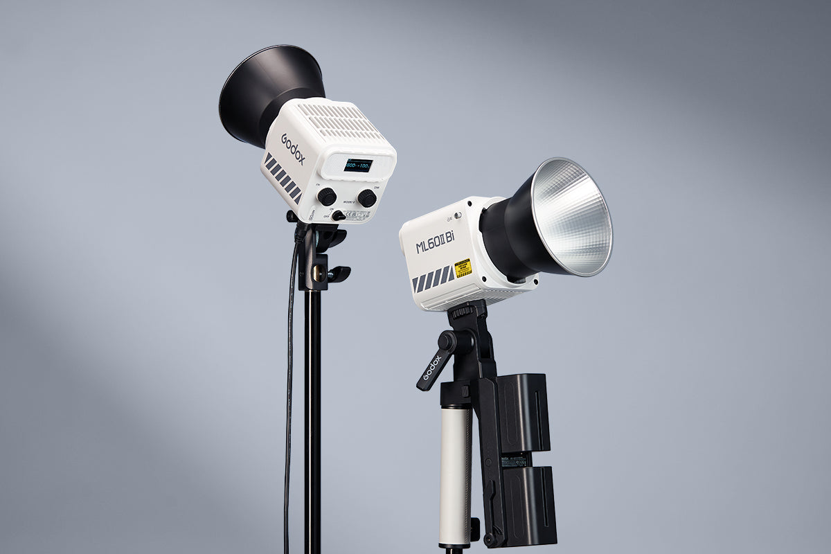 Two Godox ML60II Bi LED video lights on stands showing the rear controls and reflector