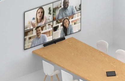 Jabra PanaCast 50 mounted below a display in a meeting room