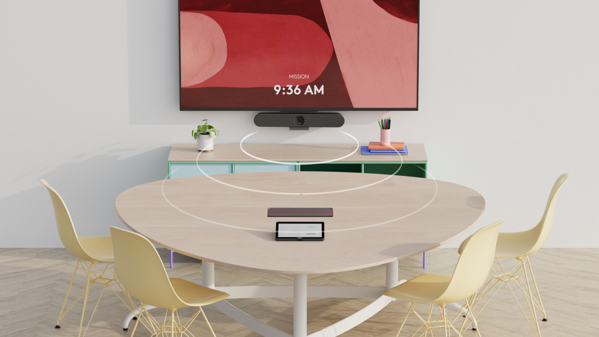 Logitech Rally Bar Huddle in a small meeting room with participants around a table