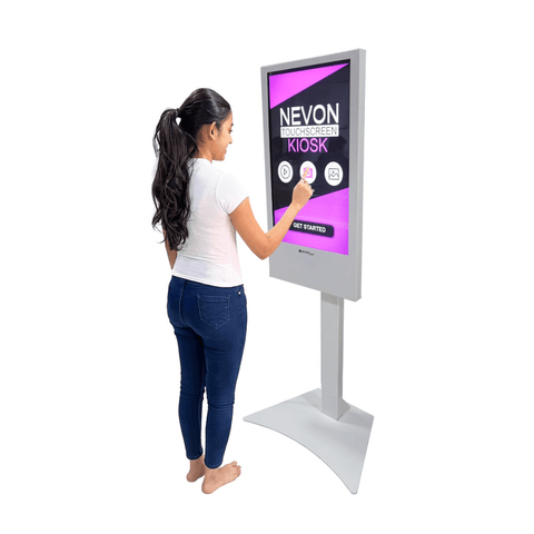 Visitor using a floor-standing touch display kiosk interactive flat panel